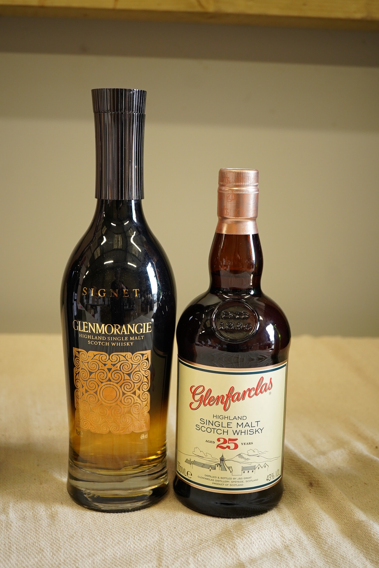 Whisky: 1 x Glenmorangie Signet, 46% abv, 70cl; 1 x Glenfarclas Single Malt 25 year old, 43% abv, 70cl (2)